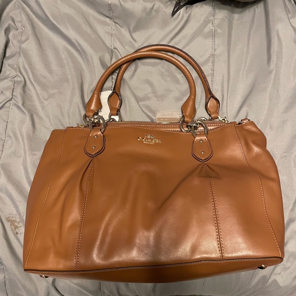 genuine coach carry all purse in the color saddle